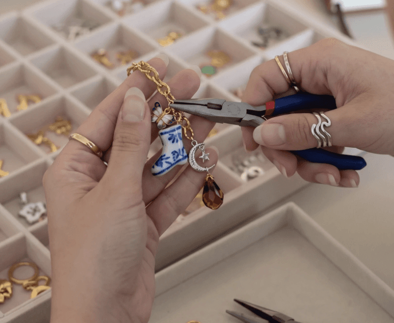 Guest assembling a custom charm accessory
