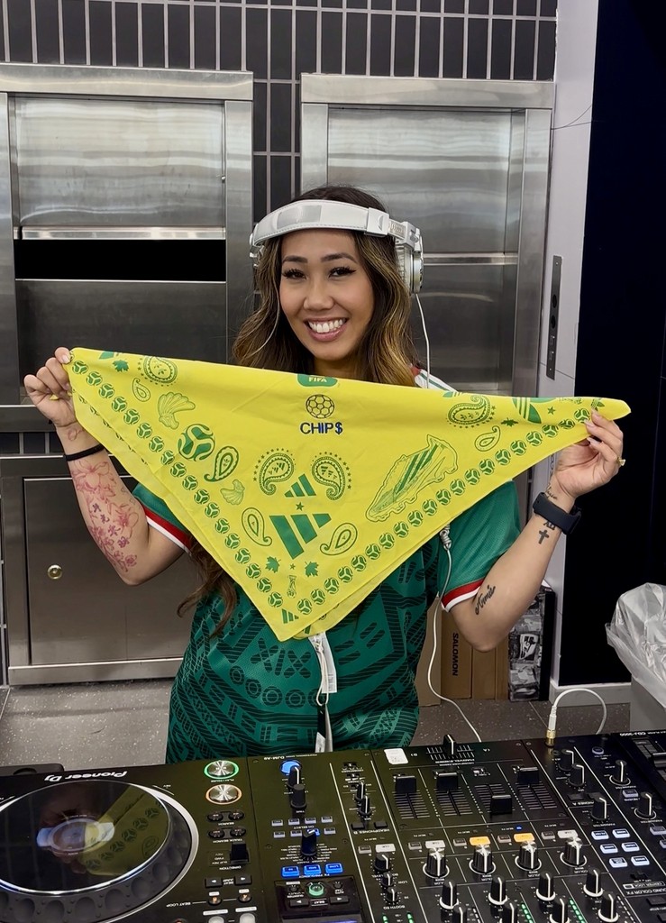 Guest holding a bandana customized with live embroidery